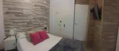 Cama o camas de una habitación en Apto con patio y barbacoa BBQ Los picadores