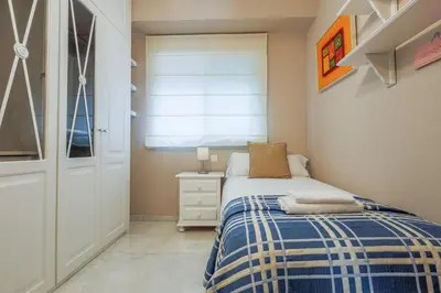 Cama o camas de una habitación en Descanso-elegancia en Sevilla Parking Gratuito