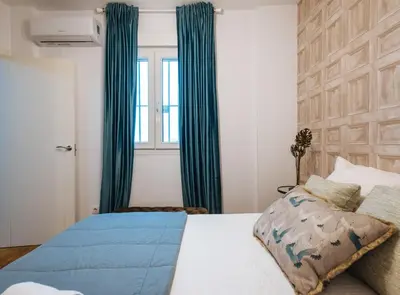 Cama o camas de una habitación en Feijóo Suite Apartment