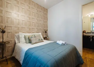 Cama o camas de una habitación en Feijóo Suite Apartment
