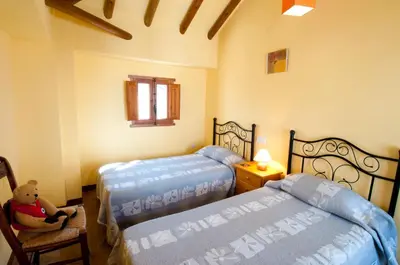 Cama o camas de una habitación en El Cortijo at Molino la Ratonera