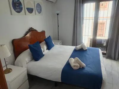 Cama o camas de una habitación en Casa Puerta de la Alcazaba Antequera