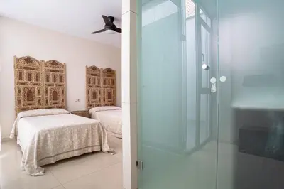Cama o camas de una habitación en Casa la Mezquita con parking gratis