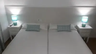 Cama o camas de una habitación en Hostal VILLA CARBULA