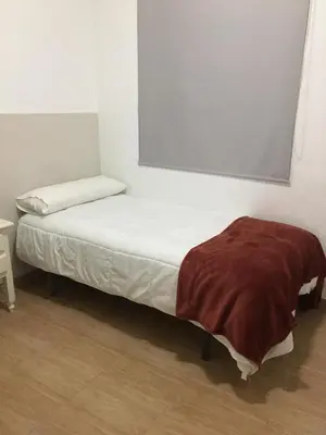 Cama o camas de una habitación en Hostal VILLA CARBULA