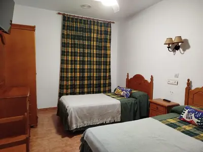 Cama o camas de una habitación en Alojamiento Árdales