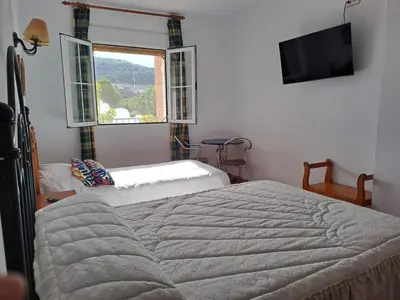 Cama o camas de una habitación en Alojamiento Árdales