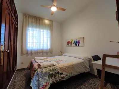 Cama o camas de una habitación en La casa del olivo en Córdoba
