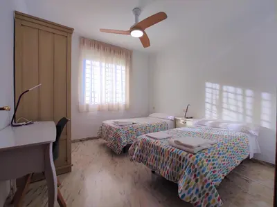 Cama o camas de una habitación en La casa del olivo en Córdoba