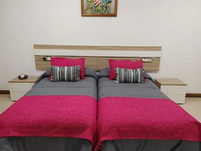 Cama o camas de una habitación en El LEGADO