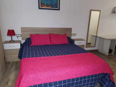Cama o camas de una habitación en El LEGADO