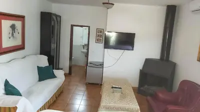 Una televisión o centro de entretenimiento en Casa Rural Los Caballos Finca Canca Alora Caminito del Rey