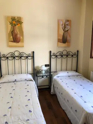 Cama o camas de una habitación en La casa de Tita Elvira 6