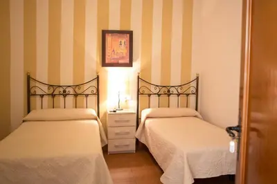 Cama o camas de una habitación en Pensión y apartamentos El Taxi