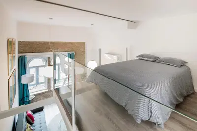 Cama o camas de una habitación en Pop Art Feria luminoso dúplex con terraza privada