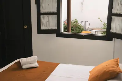 Cama o camas de una habitación en La Piquera Hostal