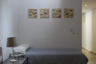Cama o camas de una habitación en PISO EN PLENO CORAZÓN DE CORDOBA