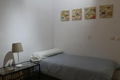 Cama o camas de una habitación en PISO EN PLENO CORAZÓN DE CORDOBA