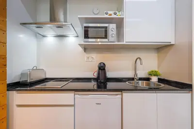 Una cocina o zona de cocina en Apartamento de diseño centro Sevilla. WiFi/AC