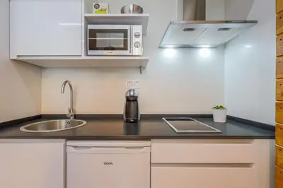 Una cocina o zona de cocina en Apartamento de diseño centro Sevilla. WiFi/AC
