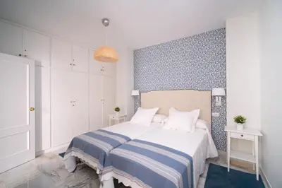 Cama o camas de una habitación en Arco Macarena Suite by SHS