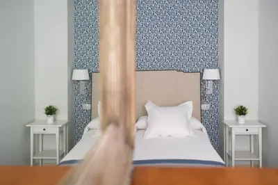 Cama o camas de una habitación en Arco Macarena Suite by SHS
