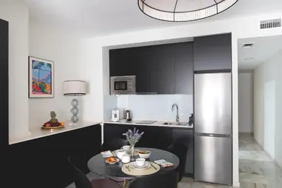 Una cocina o zona de cocina en Arco Macarena Suite by SHS
