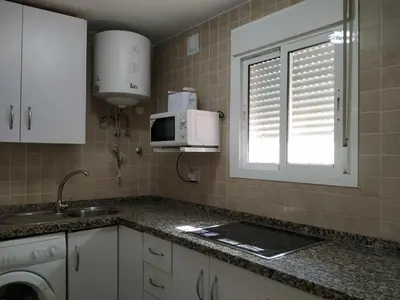 Una cocina o zona de cocina en Apartamento Torres19