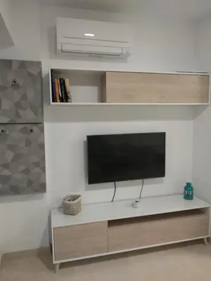 Una televisión o centro de entretenimiento en Apartamentos Cordoba