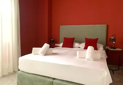 Cama o camas de una habitación en Ritual Sevilla Suites Alameda 1