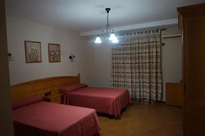 Cama o camas de una habitación en Hostal Ana