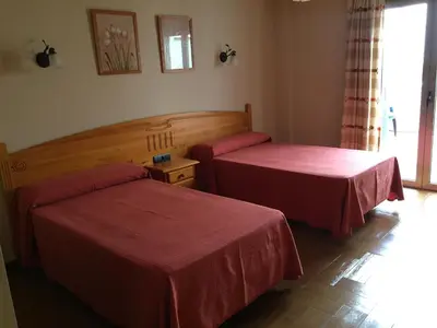 Cama o camas de una habitación en Hostal Ana