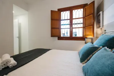 Cama o camas de una habitación en Encarnación Suite Apartment