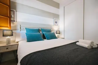 Cama o camas de una habitación en Encarnación Suite Apartment