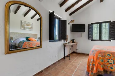Cama o camas de una habitación en Boutique B&B Cortijo Valverde Álora