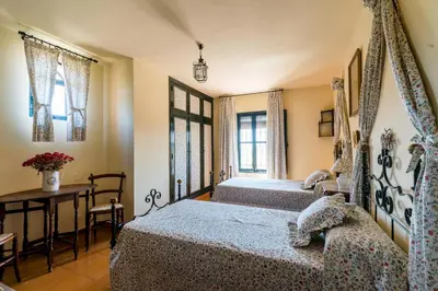 Cama o camas de una habitación en Cortijo El Carmen Finca El Revuelo