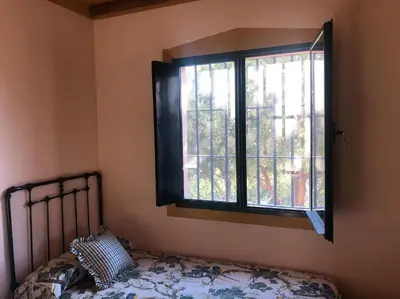 Cama o camas de una habitación en Cortijo El Carmen Finca El Revuelo
