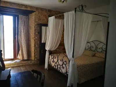Cama o camas de una habitación en HOTEL RURAL TOCAMPAVI