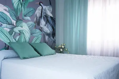 Cama o camas de una habitación en A 20 Metros De La MEZQUITA CATEDRAL ,APARTAMENTOS TURISTICO CESPEDES 5