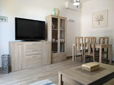 Una televisión o centro de entretenimiento en Apartamento Laila