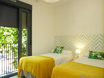 Cama o camas de una habitación en ALAMEDA SQUARE APARTMENT