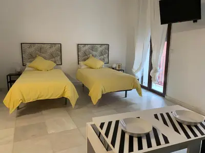 Cama o camas de una habitación en ESSE Apartamentos Las Setas