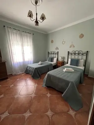 Cama o camas de una habitación en CASA RURAL EL CHAPARRO