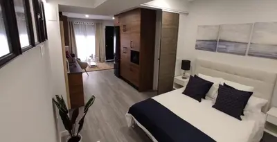 Cama o camas de una habitación en GRUPO LIMCOTEl PERLA 2