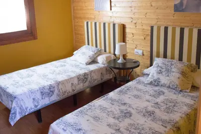 Cama o camas de una habitación en EL VENERO DE MOSTOLES