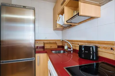 Una cocina o zona de cocina en HomeySeville-Precioso Apartamento San Juan de la Palma, Parking Optional