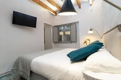 Cama o camas de una habitación en Casa 95 Sevilla