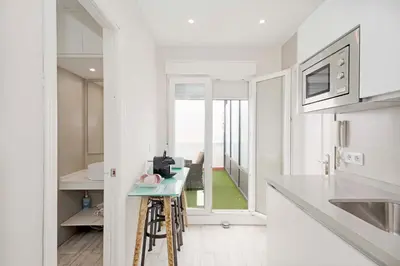 Una cocina o zona de cocina en Apartamentos Recaredo 7, Áticos con terraza