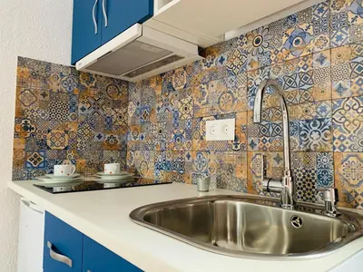 Una cocina o zona de cocina en Apartamentos La Casa del Azafrán