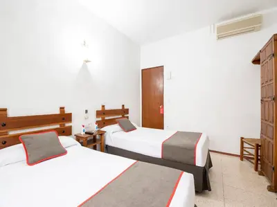 Cama o camas de una habitación en Hostal Santiago